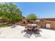 Outdoor patio with built-in grill, fireplace, and dining area at 16205 S 7Th St, Phoenix, AZ 85048