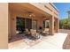 Covered patio with seating area and ceiling fans at 16205 S 7Th St, Phoenix, AZ 85048