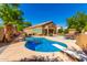 Relaxing kidney-shaped pool with diving board and patio furniture at 16205 S 7Th St, Phoenix, AZ 85048