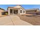 Home exterior showcasing a covered patio and desert landscaping at 169 E Canary Ct, San Tan Valley, AZ 85143