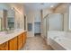 Double vanity bathroom with a soaking tub and a separate shower at 169 E Canary Ct, San Tan Valley, AZ 85143