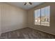 Spacious bedroom with large window and ceiling fan at 169 E Canary Ct, San Tan Valley, AZ 85143