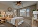 Cozy bedroom featuring a plush bed, neutral decor, and ample natural light at 169 E Canary Ct, San Tan Valley, AZ 85143