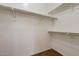 Large walk-in closet with double hanging rods and shelving at 169 E Canary Ct, San Tan Valley, AZ 85143