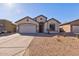 Well-maintained house with a two-car garage and neutral color scheme at 169 E Canary Ct, San Tan Valley, AZ 85143