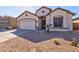 One-story house with a two-car garage and desert landscaping at 169 E Canary Ct, San Tan Valley, AZ 85143