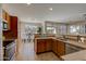 Spacious kitchen with wood cabinets, stainless steel appliances, and an eat-in area at 169 E Canary Ct, San Tan Valley, AZ 85143