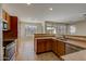 Spacious kitchen featuring wood cabinets, stainless steel appliances, and tile flooring at 169 E Canary Ct, San Tan Valley, AZ 85143