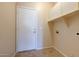 Laundry room with storage cabinets and exterior access at 169 E Canary Ct, San Tan Valley, AZ 85143