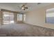 Living room with sliding glass doors leading to a patio at 169 E Canary Ct, San Tan Valley, AZ 85143