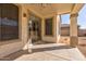 Covered patio with sliding glass door and view of backyard at 169 E Canary Ct, San Tan Valley, AZ 85143