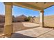 Covered patio overlooking a gravel backyard with a concrete slab at 169 E Canary Ct, San Tan Valley, AZ 85143