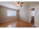 Bedroom with wood floors and exterior access at 170 E Guadalupe Rd # 174, Gilbert, AZ 85234