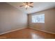 Bright bedroom with wood floors and ceiling fan at 170 E Guadalupe Rd # 174, Gilbert, AZ 85234