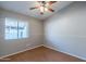 Bright bedroom with wood floors and a window at 170 E Guadalupe Rd # 174, Gilbert, AZ 85234