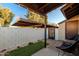 Private patio with artificial turf and seating at 170 E Guadalupe Rd # 174, Gilbert, AZ 85234