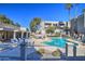 Community pool with lounge chairs and surrounding landscaping at 1720 E Thunderbird Rd # 2010, Phoenix, AZ 85022