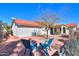 Backyard with patio, two chairs, and a tree at 1745 N Terrace Cir, Casa Grande, AZ 85122