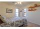 Well-lit bedroom with ceiling fan and large window at 1745 N Terrace Cir, Casa Grande, AZ 85122