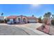 Single-story home with red tile roof, arched entryway, and landscaped front yard at 1745 N Terrace Cir, Casa Grande, AZ 85122