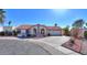 Single-story home with red tile roof, arched entryway, and landscaped front yard at 1745 N Terrace Cir, Casa Grande, AZ 85122