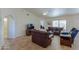 Spacious living room with leather furniture and tile floors at 1745 N Terrace Cir, Casa Grande, AZ 85122