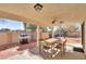 Patio with seating area, grill, and ceiling fan at 1745 N Terrace Cir, Casa Grande, AZ 85122