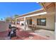 Covered patio with dining furniture and grill at 1745 N Terrace Cir, Casa Grande, AZ 85122