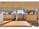 Covered patio with dining table and grill at 1745 N Terrace Cir, Casa Grande, AZ 85122