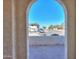 View of a residential street from an arched entryway at 1745 N Terrace Cir, Casa Grande, AZ 85122