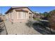 Landscaped backyard with gravel, bushes, and a view of the home at 17563 W Fairview St, Goodyear, AZ 85338