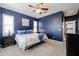 Primary bedroom with blue walls, a ceiling fan, and plenty of natural light at 17563 W Fairview St, Goodyear, AZ 85338