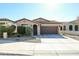 Single-story home with brown garage door and landscaped front yard at 17563 W Fairview St, Goodyear, AZ 85338