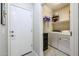 Convenient laundry room with washer, dryer, and extra storage at 17563 W Fairview St, Goodyear, AZ 85338