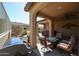 Outdoor patio with seating area, fire pit, and built-in grill at 17563 W Fairview St, Goodyear, AZ 85338