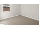 Neutral bedroom with a window providing natural light and fresh paint at 17761 W Elm St, Goodyear, AZ 85395