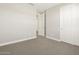 Neutral bedroom featuring a closet and ensuite bathroom at 17761 W Elm St, Goodyear, AZ 85395