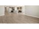 Open living space displaying tile floors leading to a kitchen area at 17761 W Elm St, Goodyear, AZ 85395