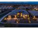 Stunning aerial view of a single-story home at night at 17904 E Veit Springs Dr, Rio Verde, AZ 85263