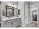 Modern bathroom with vanity and walk-in closet at 17904 E Veit Springs Dr, Rio Verde, AZ 85263