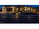 Stunning curb appeal with desert landscaping at night at 17904 E Veit Springs Dr, Rio Verde, AZ 85263