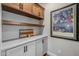 Bright pantry with wood cabinets and open shelving at 17904 E Veit Springs Dr, Rio Verde, AZ 85263