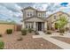 Two-story home with welcoming front porch and well-maintained lawn at 17909 N 114Th Dr, Surprise, AZ 85378