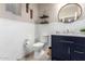 Updated bathroom with a navy vanity, shiplap walls, and modern fixtures at 18475 W Via Del Sol --, Surprise, AZ 85387