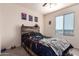 Bright bedroom with large window and built-in shelving at 18475 W Via Del Sol --, Surprise, AZ 85387