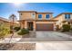 Two-story house with a brown garage door and landscaped front yard at 18475 W Via Del Sol --, Surprise, AZ 85387