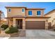 Two-story house with a brown garage door and landscaped front yard at 18475 W Via Del Sol --, Surprise, AZ 85387