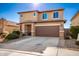 Two-story house with a brown garage door and landscaped front yard at 18475 W Via Del Sol --, Surprise, AZ 85387