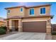 Two-story house with a brown garage door and landscaped front yard at 18475 W Via Del Sol --, Surprise, AZ 85387