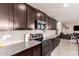 Modern kitchen features stainless steel appliances and granite countertops at 18475 W Via Del Sol --, Surprise, AZ 85387